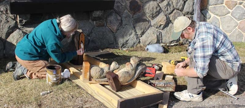 Pergola roof - Steve Fifield and Sue prepping the squirrel finial for placement 4-9-2024
