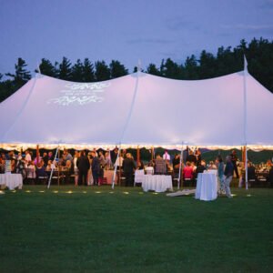 A tented wedding celebration in the Meadows at Shannon Pond